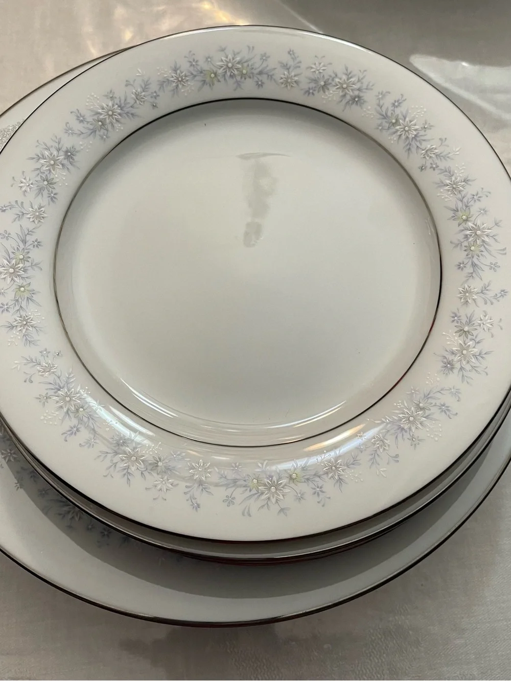 Noritake White Dinner Plate with Pale Blue Floral and Silver Trim